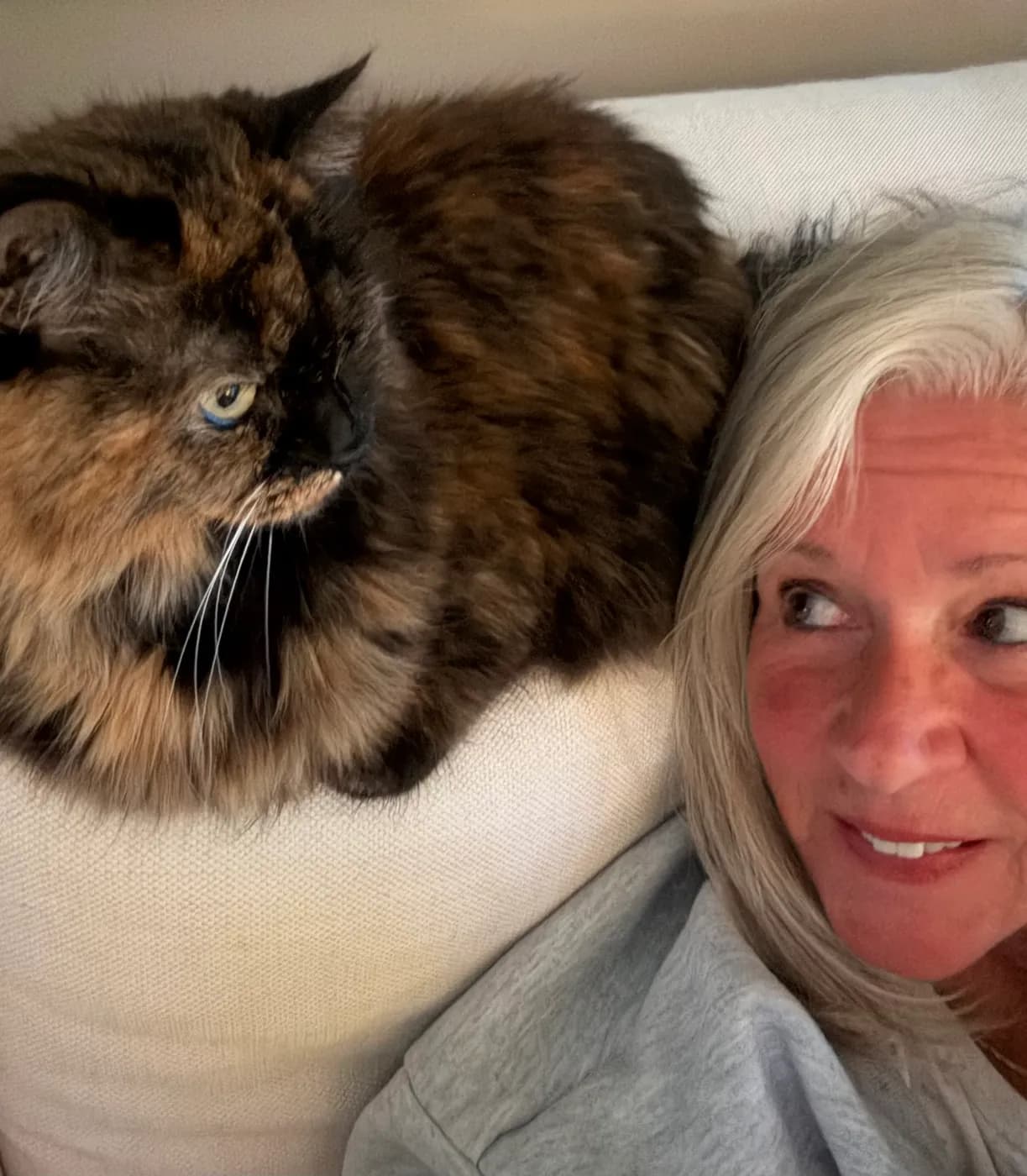 Jamie Lesko, Medford pet sitter, with a cat she cares for